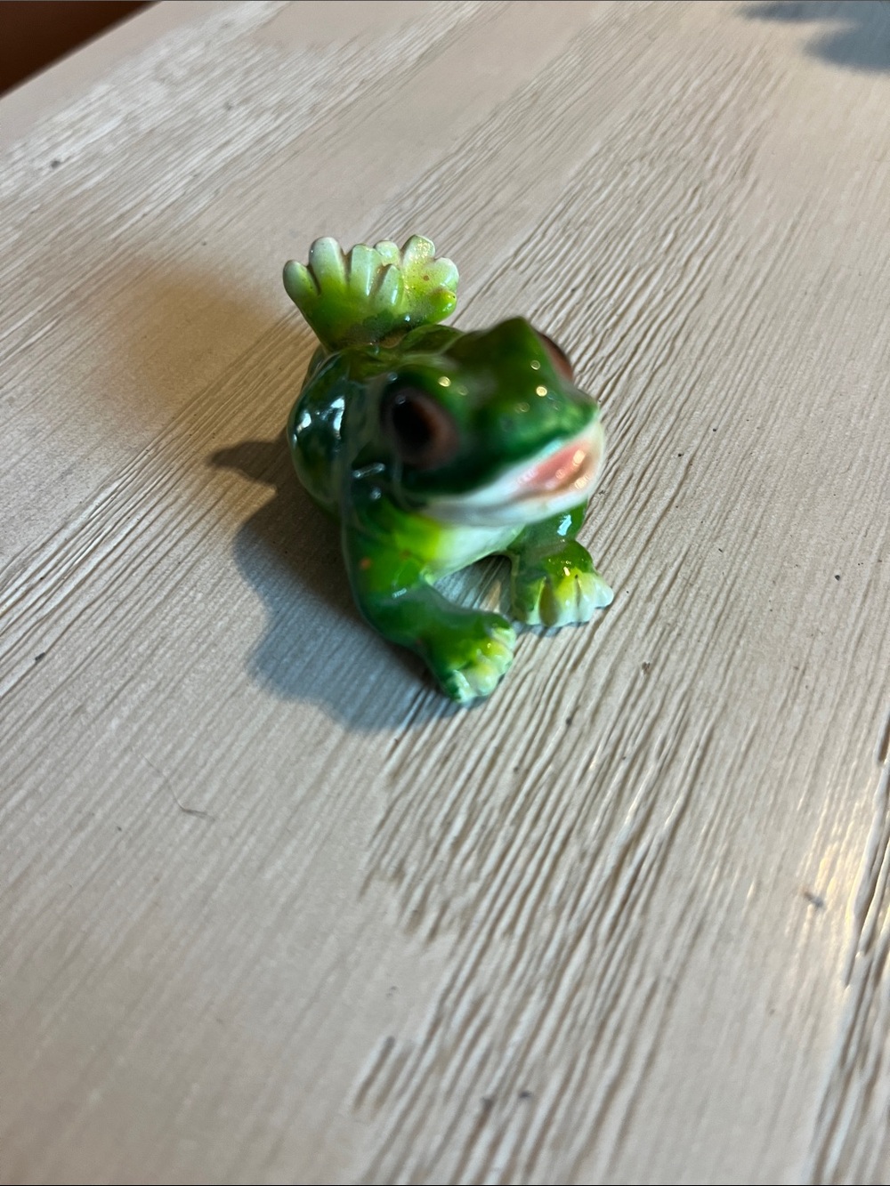 Ceramic green frog chilling